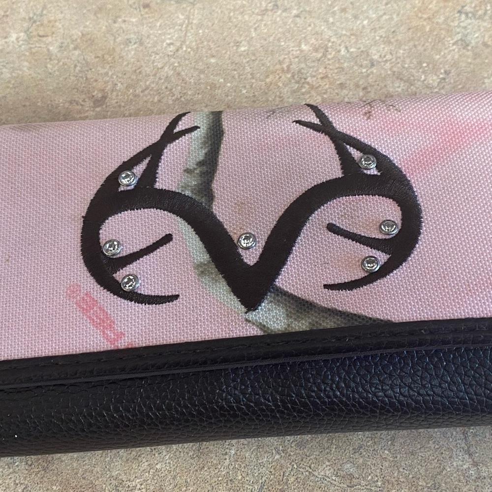 Mossy Oak wallet and Mossy Oak pink camo pocketbook used in good condition. $20